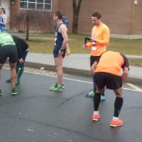 <p>A couple of runners trying to catch their breath after being among the top finishers in the 10k Boston Buildup race Sunday in Norwalk.</p>