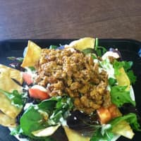 <p>License 2 grill&#x27;s Southwest Salad which consists of turkey, Homemade Ranch Dressing, and organic salad greens in a taco shell.</p>