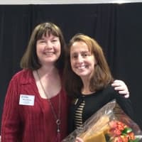 <p>Nadine Tanen, right, the state member Realtor of the Year, accepts flowers from Deb Alderson.</p>