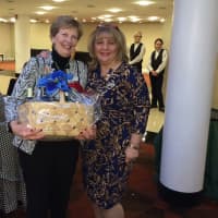 <p>Betty Hensal, left, won a raffle prize and accepts it from Margaret Nagy Hamilton.</p>