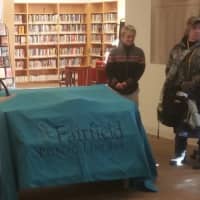 <p>Town Librarian Karen Ronald address a large crowd gathered in the Fairfield Public Library&#x27;s Lobby before revealing this year&#x27;s selection.</p>
