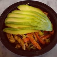 <p>Chicken quinoa bowl with sautéed vegetables and topped with fresh avocado.</p>