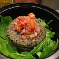 <p>Black bean, shiitake, quinoa burger. Over a bed of spinach topped with fresh salsa.</p>