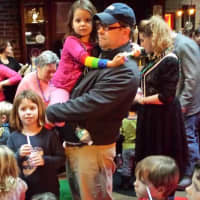 <p>Darci Healy, 7 and her dad holding her sister, Addie Healy, 5 were enjoying the workshop. </p>