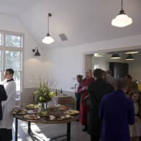 <p>People gathered in the new hall for food and celebration.</p>