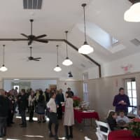 <p>Crowds gather to enjoy the new Village Hall at St. James Church.</p>