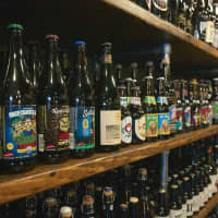 <p>Dozens of beers fill the shelves at Brew &amp; Co.</p>