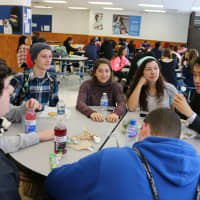 <p>Keith Yi talks with students at lunch after coming to Walter Panas High School as the new principal in early January.</p>