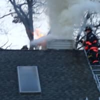 <p>Firefighters kept the fire confined to the chimney area at the roof line and above.</p>
