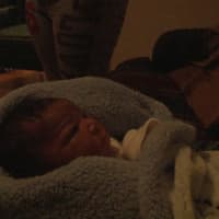 <p>Baby JaKhi was born in his Bridgeport home on Friday, delivered by firefighters and medics. </p>