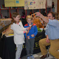 <p>Second-graders Charlotte Ruhe and Everett Trygg with Chris Evers getting to know Sanora the king snake.</p>