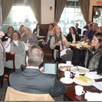 <p>Webster Bank economic adviser Nick Perna speaks to a crowd of about 30 people during a breakfast meeting hosted by the Wilton Chamber of Commerce.</p>