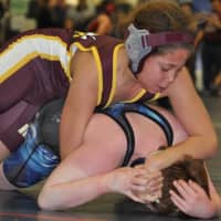 <p>Koy Price of the Norwalk Mad Bulls youth wrestling team holds the upper hand against an opponent.</p>