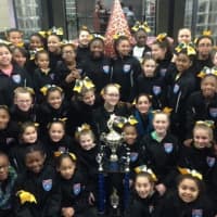 <p>Girls from the Norwalk Packers cheerleading teams gathered at Norwalk City Hall for a proclamation from Mayor Harry Rilling. Two Packers cheer teams won national titles in December.</p>