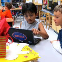 <p>Todd Elementary School fourth-grade students taught first-graders how to play Cool Math games using individual presentations on their personal devices.</p>