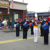 <p>Joe Mazzullo, left, leads the Westchester Brassmen Drug &amp; Bugle Corps during the Columbus Day Parade in Harrison.</p>
