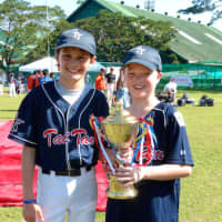 <p>Weston resident, Sam Hensinger, 10, and Wilton resident, Chris Jones, 11. first met on a baseball field in Hong Kong. Here they are pictured in the Philippines for a baseball tournament.

</p>