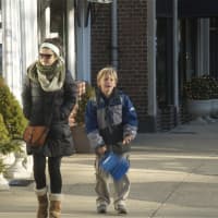 <p>Residents try to stay warm on the streets of Mamaroneck.</p>