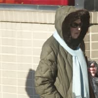 <p>Walking along Mamaroneck Avenue, residents try to stay warm.</p>