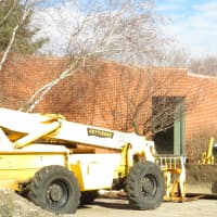 <p>Bulldozers outside Harrison Public Library on Tuesday. Construction began on Oct. 27.</p>