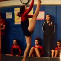 <p>Darien YMCA Level 7 gymnast Aisling Brock performing her floor routine on the way to winning the All Around title for the Senior age group. </p>