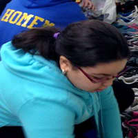 <p>A student lines up her sneakers.</p>