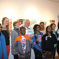 <p>NHA student artists pose with teacher Lillie Fortino, Silvermine Educational Outreach Director Sophia Gevas, Mayor Rilling, and NHA After-School Program Director Wendy Gerbier (far right) at an exhibition of their work at the Silvermine Arts Center. </p>
