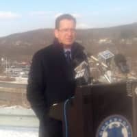<p>Transportation Commissioner James Redeker and Gov. Dannel Malloy sell their transportation initiative from the rest area at Exit 2 of I-84 in Danbury on Thursday morning. </p>