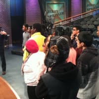 <p>Adam Soroto, at left, senior director, explains how &quot;The Jerry Springer Show&quot; is produced while Future 5 students are on the set during a tour of NBCUniveral&#x27;s Stamford Media Center.</p>