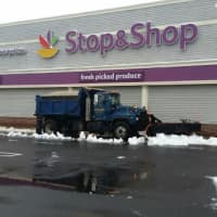 <p>Plows go to to work on the parking lot at Super Stop &amp; Shop on Kings Highway Cutoff on Saturday morning. </p>