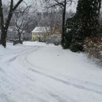 <p>Noyes Road in Fairfield is snow-covered Saturday after the overnight storm. </p>