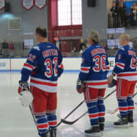 <p>New York Ranger All-Stars listening to the national anthem before the game.</p>