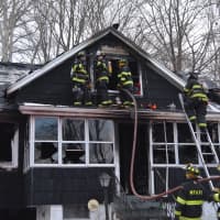<p>Firefighters respond to a residential blaze in Mahopac Falls.</p>