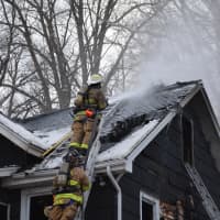 <p>Firefighters respond to a house fire in Mahopac Falls.</p>