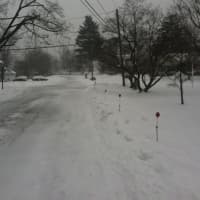 <p>Few cars are out on the slippery streets of Stamford on Tuesday. </p>