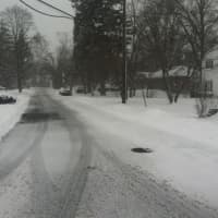 <p>The roads in Stamford are covered with snow and slush on Tuesday morning. </p>