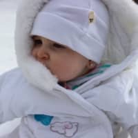 <p>Madison Iannacone, 9 months old, 
gets her first glimpse of snow. </p>
