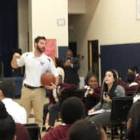 <p>Marcus Ginyard, and Markeith Cummings of the Westchester Knicks with Mr. Settler of the Physical Education department.</p>