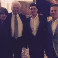 <p>Dean Valente from Chappaqua, second from right, stands with (from left) his mother, Joy Valente, Michael Perry, treasurer of the county chapter of the National Football Foundation, and his father, Anthony Valente, at the Golden Dozen banquet.</p>