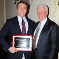 <p>Steven Ircha of Bronxville High School will Michael Perry, the treasurer of the Westchester Chapter of the National Football Foundation and Hall of Fame.</p>