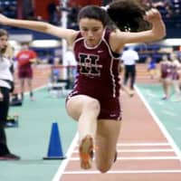 <p>Julia Provino placing first in the league championship triple jump, with a new personal best record.</p>