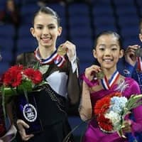 <p>The podium for Juvenile girls includes, from left, second place, Emilia Murdock; first place, Sophia Chouinard; third place, Jacqueline Lee; and fourth place, Isabella Miller. USFSA awards four medals on its podium at nationals. </p>