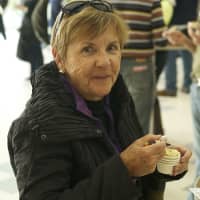<p>Cindy Fitzgerald, of Westport, enjoys some chili.</p>