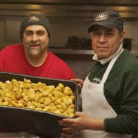 <p>Chicken Joe owner Joe Marini, left, shows off a tray of his popular chicken nuggets.</p>