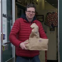 <p>Customers leave Chicken Joe&#x27;s with lots of food. </p>