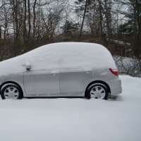 <p>A car covered in snow following Monday&#x27;s snowstorm</p>