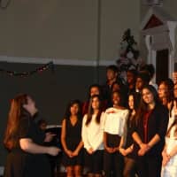 <p>The high school chorus performs at the annual holiday concert.</p>
