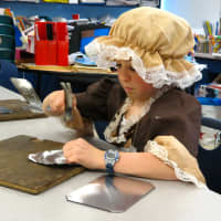 <p>Croton-Harmon fourth graders created original design in the tin-smithing workshop during Colonial Day.</p>