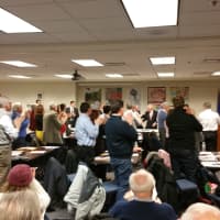 <p>A reserved Representative Town Meeting - which held its applause for almost the entirety of First Selectman Michael Tetreau&#x27;s State of the Town address - gives Tetreau a standing ovation.</p>