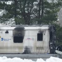 <p>Metro-North workers towed away the damaged train car from Tuesday&#x27;s crash, and service has resumed on the Harlem Line.</p>
